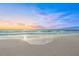 Soft waves on sandy beach at sunset at 1358 Moonmist Dr # B4, Sarasota, FL 34242