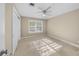 Bedroom with double door closet and window shutters at 1358 Moonmist Dr # B4, Sarasota, FL 34242