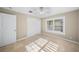 Bright bedroom with tiled floor and ceiling fan at 1358 Moonmist Dr # B4, Sarasota, FL 34242