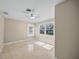 Bright bedroom with tile floors and ceiling fan at 1358 Moonmist Dr # B4, Sarasota, FL 34242