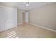 Well-lit bedroom with built-in closet and tile floors at 1358 Moonmist Dr # B4, Sarasota, FL 34242