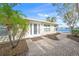 Front entry of home with white door and paver walkway at 1358 Moonmist Dr # B4, Sarasota, FL 34242