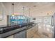 Modern kitchen with granite countertops and stainless steel appliances at 1358 Moonmist Dr # B4, Sarasota, FL 34242