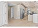 Modern kitchen with stainless steel appliances and tile floor at 1358 Moonmist Dr # B4, Sarasota, FL 34242