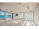 Bright living room with water views, tile floors, and high ceilings at 1358 Moonmist Dr # B4, Sarasota, FL 34242