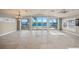 Sunlit living room showcasing water views and large windows at 1358 Moonmist Dr # B4, Sarasota, FL 34242