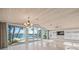 Bright living room with water views and sliding glass doors at 1358 Moonmist Dr # B4, Sarasota, FL 34242