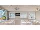 Spacious living area featuring tile floors, ceiling fan, and water views at 1358 Moonmist Dr # B4, Sarasota, FL 34242