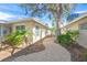 Brick pathway meanders past the home to waterfront access at 1358 Moonmist Dr # B4, Sarasota, FL 34242