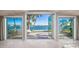Stunning water view from inside the home with access to patio at 1358 Moonmist Dr # B4, Sarasota, FL 34242