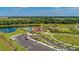 Aerial view of community with pool, parking and clubhouse at 14118 Florida Rosemary Dr, Bradenton, FL 34211
