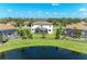 Aerial view of house and community, including lake at 14118 Florida Rosemary Dr, Bradenton, FL 34211