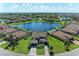 Luxury home with lakefront lot, paver driveway and lush landscaping at 14118 Florida Rosemary Dr, Bradenton, FL 34211