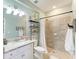 Spa-like bathroom with a walk-in shower and granite vanity at 14118 Florida Rosemary Dr, Bradenton, FL 34211