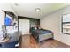 Serene bedroom with a full-size bed and lightning bolt wall at 14118 Florida Rosemary Dr, Bradenton, FL 34211