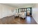 Serene bedroom with two armchairs and wood flooring at 14118 Florida Rosemary Dr, Bradenton, FL 34211