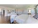 Main bedroom with large bed and built-in shelving at 14118 Florida Rosemary Dr, Bradenton, FL 34211