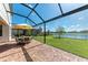 Screened patio with table and chairs, lake view at 14118 Florida Rosemary Dr, Bradenton, FL 34211