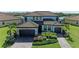 Two-story home with tile roof, paver driveway and neatly landscaped yard at 14118 Florida Rosemary Dr, Bradenton, FL 34211