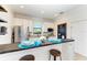 Well-appointed kitchen with white shaker cabinets, granite countertops, and breakfast bar at 14118 Florida Rosemary Dr, Bradenton, FL 34211