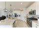 Open kitchen boasting granite counters, stainless steel appliances, and an island at 14118 Florida Rosemary Dr, Bradenton, FL 34211
