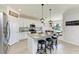 Spacious kitchen with island, stainless steel appliances, and white cabinets at 14118 Florida Rosemary Dr, Bradenton, FL 34211