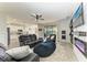 Living room with fireplace, leather furniture and view into the kitchen at 14118 Florida Rosemary Dr, Bradenton, FL 34211