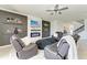 Open concept living room with fireplace and access to backyard at 14118 Florida Rosemary Dr, Bradenton, FL 34211