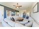Open concept living room with sectional sofa and a built-in entertainment center at 14118 Florida Rosemary Dr, Bradenton, FL 34211