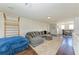 Relaxing loft with gray sectional and built-in shelving units at 14118 Florida Rosemary Dr, Bradenton, FL 34211