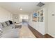 Bright loft area with white built-ins and a large sectional sofa at 14118 Florida Rosemary Dr, Bradenton, FL 34211