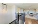 Open loft area with wood flooring, gray sofa, and built-in shelving at 14118 Florida Rosemary Dr, Bradenton, FL 34211