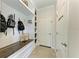 Functional mudroom with built-in bench, cubbies, and hooks for storage at 14118 Florida Rosemary Dr, Bradenton, FL 34211