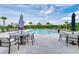 Community pool with plenty of seating and umbrellas at 14118 Florida Rosemary Dr, Bradenton, FL 34211