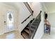 Elegant staircase with dark wood and metal railings at 14118 Florida Rosemary Dr, Bradenton, FL 34211