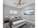 Comfortable guest bedroom with calming decor and ample natural light at 14611 Barefoot Ln, Parrish, FL 34219
