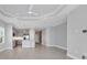 Open concept living room and kitchen with high ceilings and tile floors at 14611 Barefoot Ln, Parrish, FL 34219