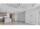 Open living room and kitchen with high ceilings and tile floors at 14611 Barefoot Ln, Parrish, FL 34219