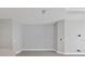 Neutral-toned living room with large empty wall, ready for decor at 14611 Barefoot Ln, Parrish, FL 34219