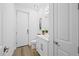 Clean bathroom with white vanity, toilet, and modern fixtures at 577 Venice Ln, Sarasota, FL 34242