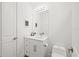 Simple bathroom with white vanity, toilet and modern fixtures at 577 Venice Ln, Sarasota, FL 34242