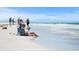 Couple enjoying a relaxing day at the beach at 577 Venice Ln, Sarasota, FL 34242