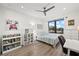 Cozy bedroom with built-in shelving, large window, and workspace at 577 Venice Ln, Sarasota, FL 34242