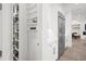 Modern kitchen with white cabinets, stainless steel appliances, and walk-in pantry at 577 Venice Ln, Sarasota, FL 34242