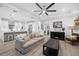 Spacious living room with beige couch and media console at 577 Venice Ln, Sarasota, FL 34242