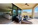 Covered back porch with outdoor seating and direct access to the living room at 12661 Oak Hill Way, Parrish, FL 34219
