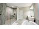 The bathroom features a glass-enclosed shower, soaking tub, and large vanity at 12661 Oak Hill Way, Parrish, FL 34219