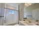 Clean bathroom featuring a bathtub, a shower, and a large mirror above the vanity with storage at 12661 Oak Hill Way, Parrish, FL 34219