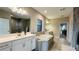 A luxurious bathroom featuring a soaking tub, double vanity, and large glass-enclosed shower at 12661 Oak Hill Way, Parrish, FL 34219