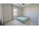 Bright bedroom with a large window and comfortable carpeting at 12661 Oak Hill Way, Parrish, FL 34219